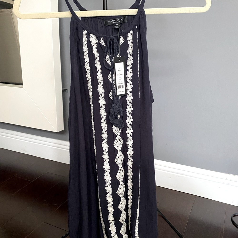 Romeo & Juliet Couture navy and cream crochet appliqué. Size medium, never worn